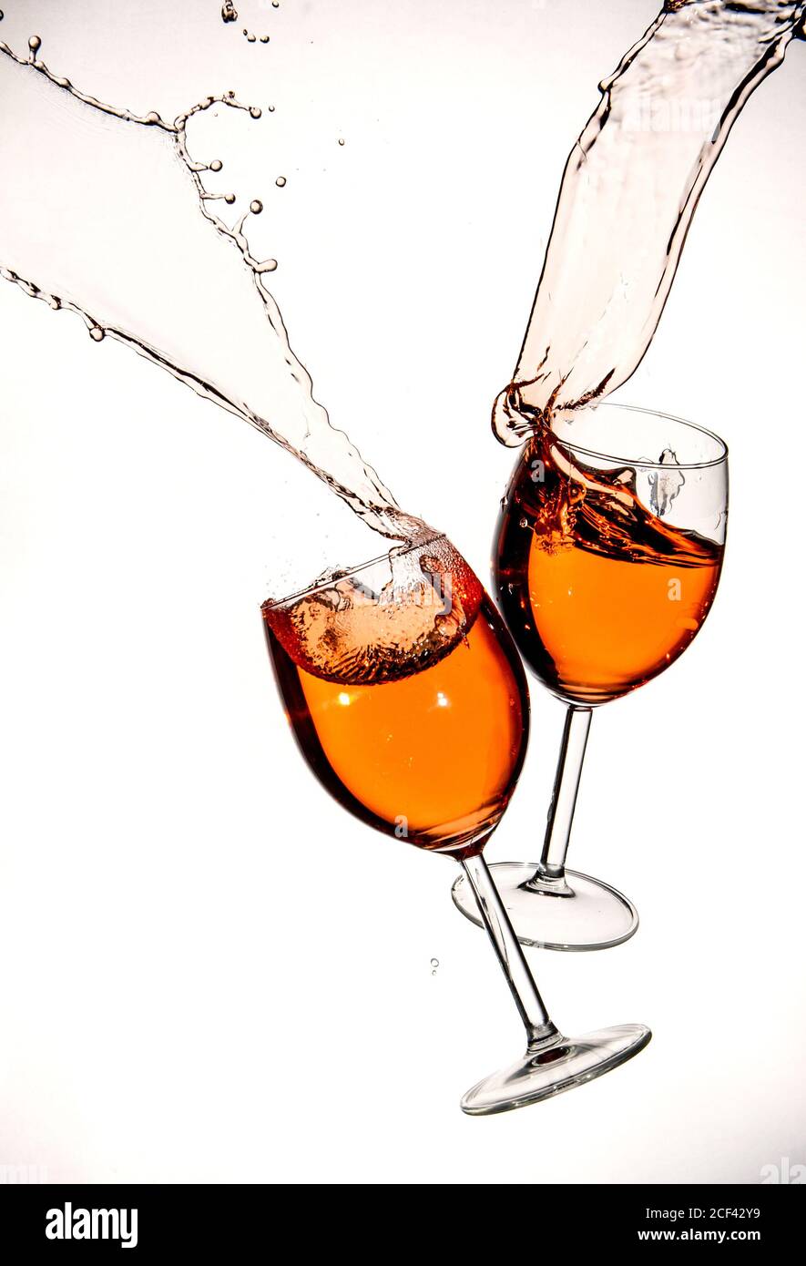 Red wine in glasses with splashes on a white background isolated Stock Photo