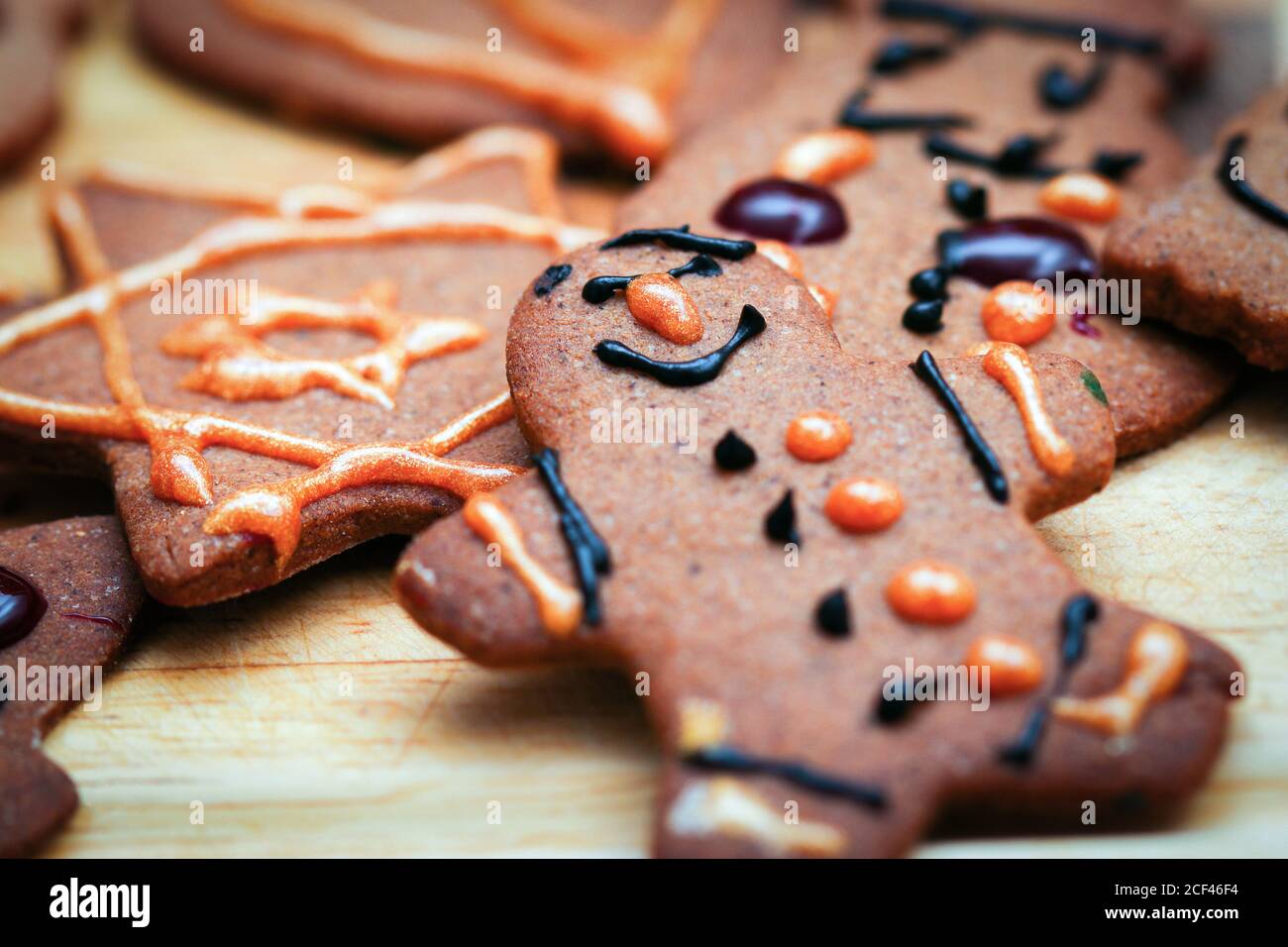 Closeup on children hand decorated christmas gingerbread cookie man figurine Stock Photo