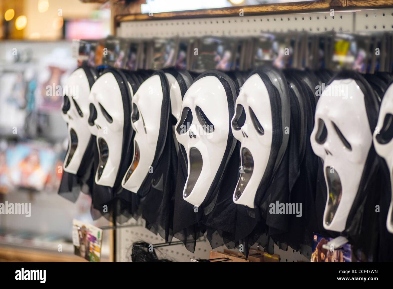 Halloween mask from supermarket shelf.Mask horrible for Halloween in the store on the counter. Halloween concept. Stock Photo