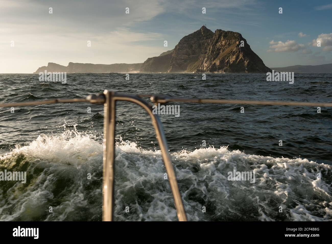 Cape of Good Hope seen from a yacht rounding the Cape from East to West in calm conditions and late afternoon light.  Atlantic Ocean off South Africa. Stock Photo