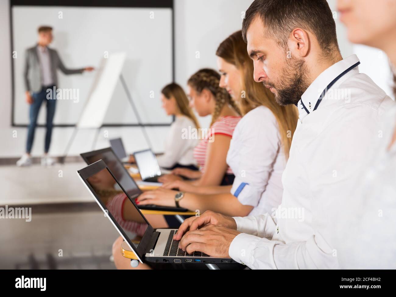 Group working with laptops hi-res stock photography and images - Alamy