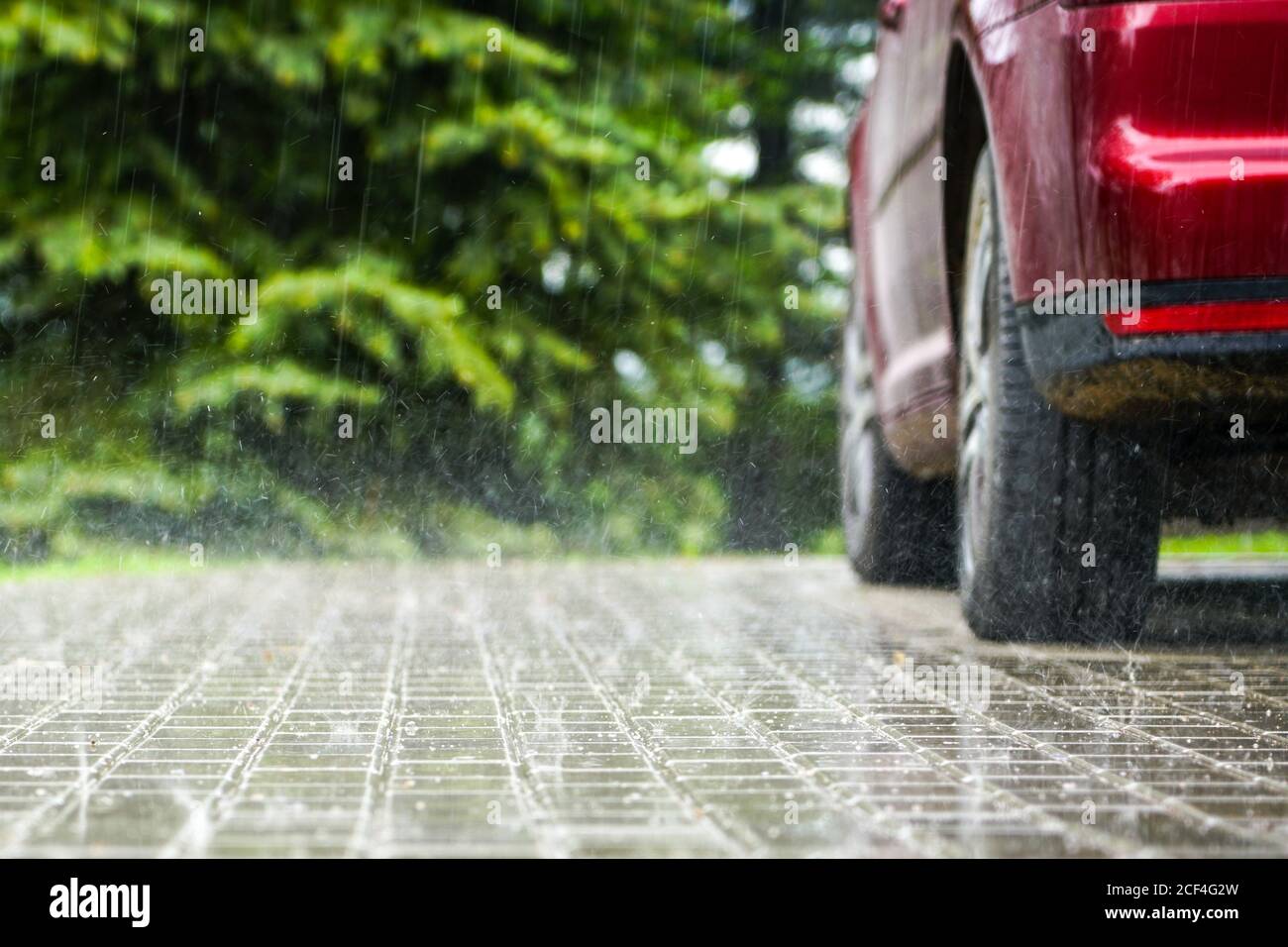 raindrops fall on a paved area, blurred background Stock Photo