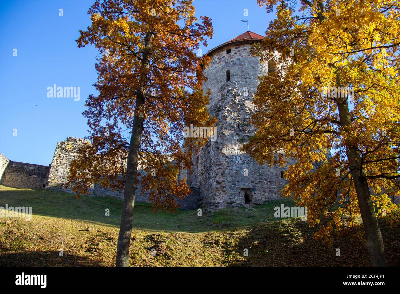 Autumn Park With Old Castle Ruins in Cesis, Latvia. 13th Century Ancient Livonian Castle Stock Photo