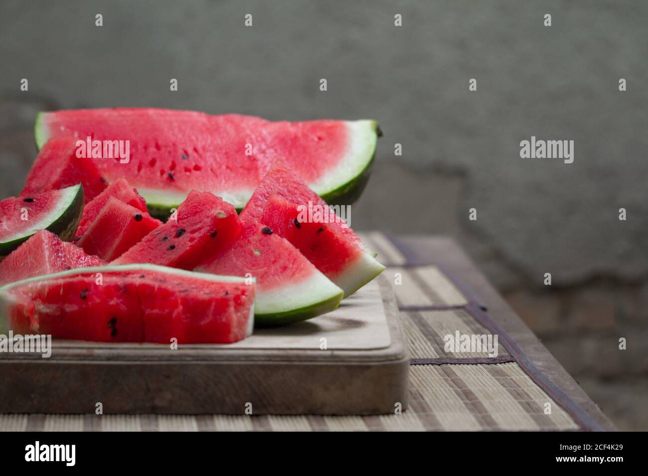 Fresh red watermelon on wooden cutting board, picnic concept, selective focus Stock Photo