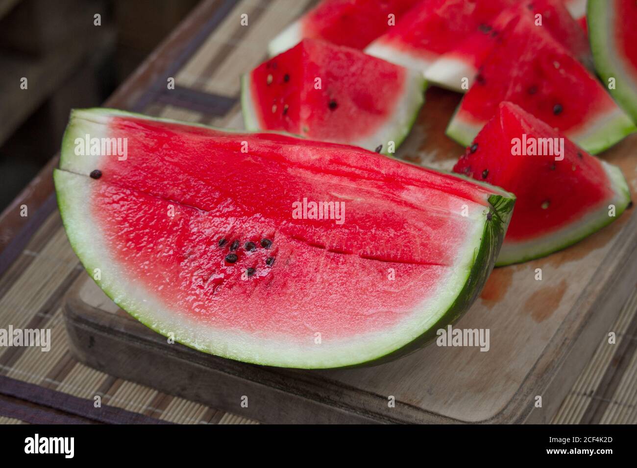 Fresh red watermelon on wooden cutting board, picnic concept, selective focus Stock Photo