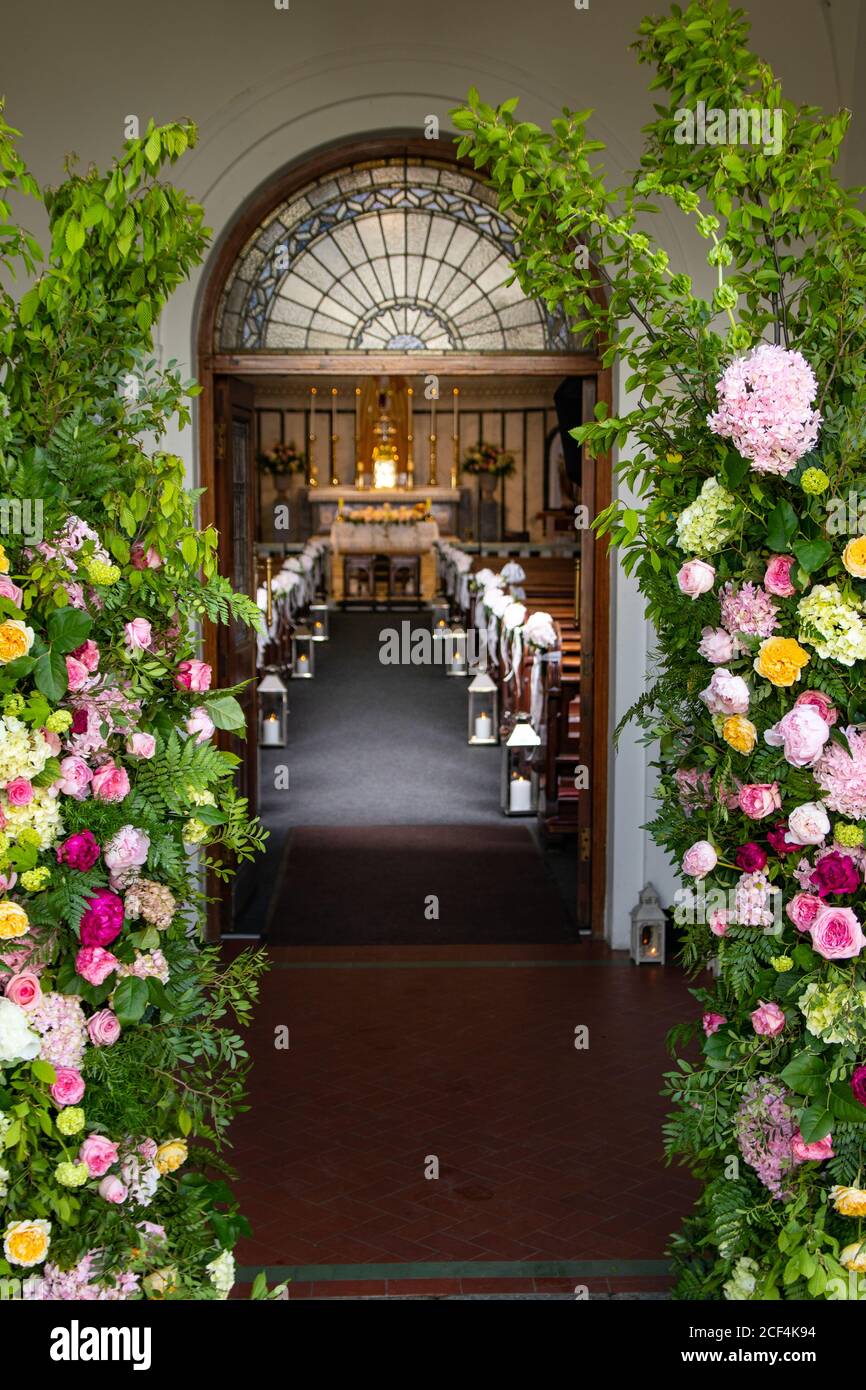 Interior of a catholic church, beautifully decorated with flowers for a wedding ceremony Stock