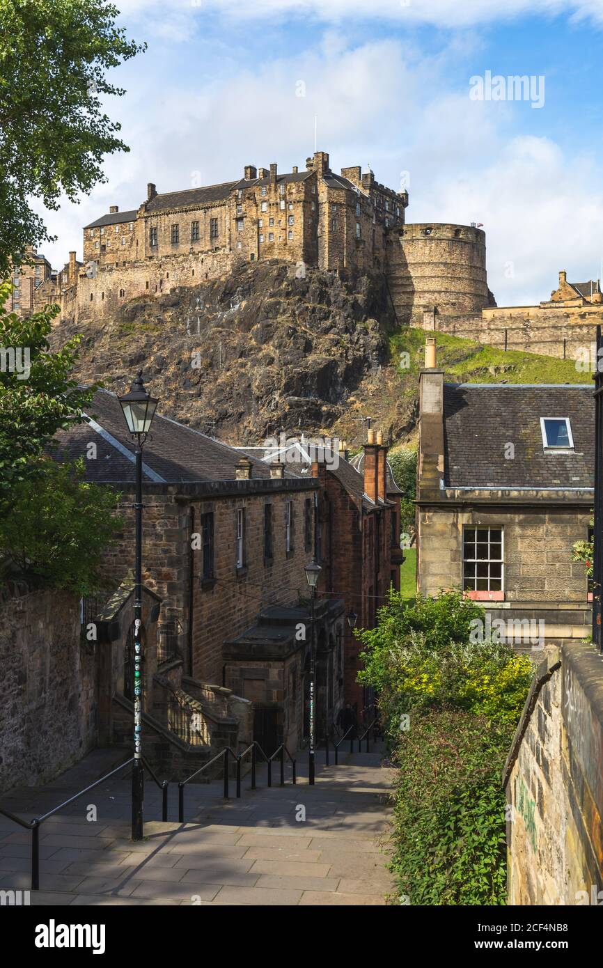 Edinburgh Castle on top of the rock taken from the Vennel showing the Victorian lamps lining the street, Scotland, United Kingdom Stock Photo