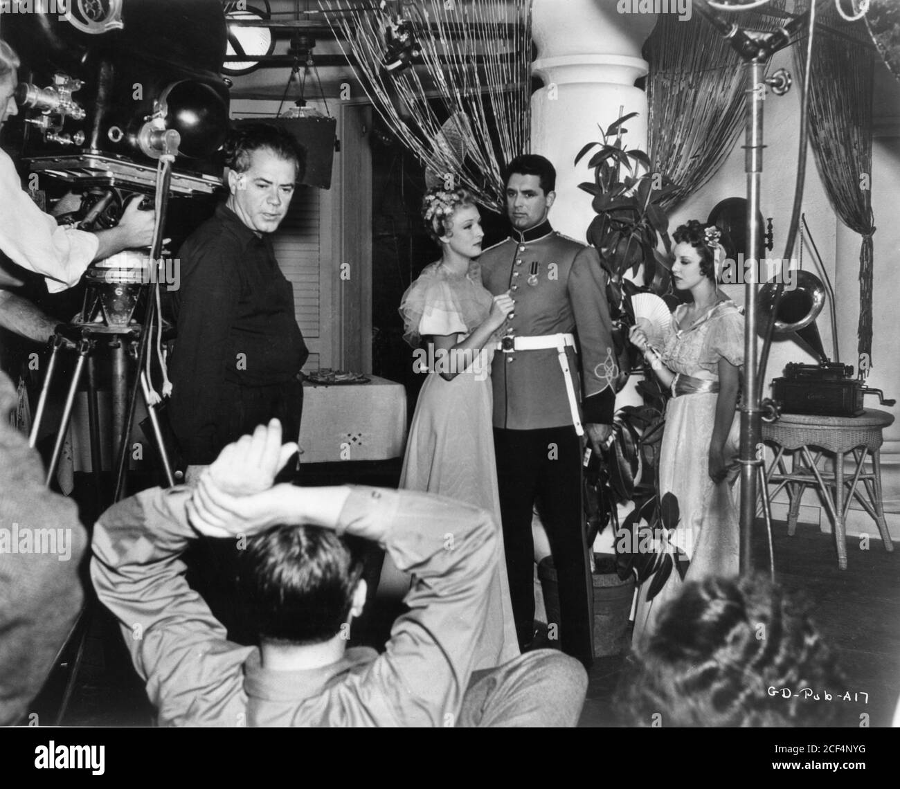 Cinematographer JOSEPH H. AUGUST and CARY GRANT on set candid during ...