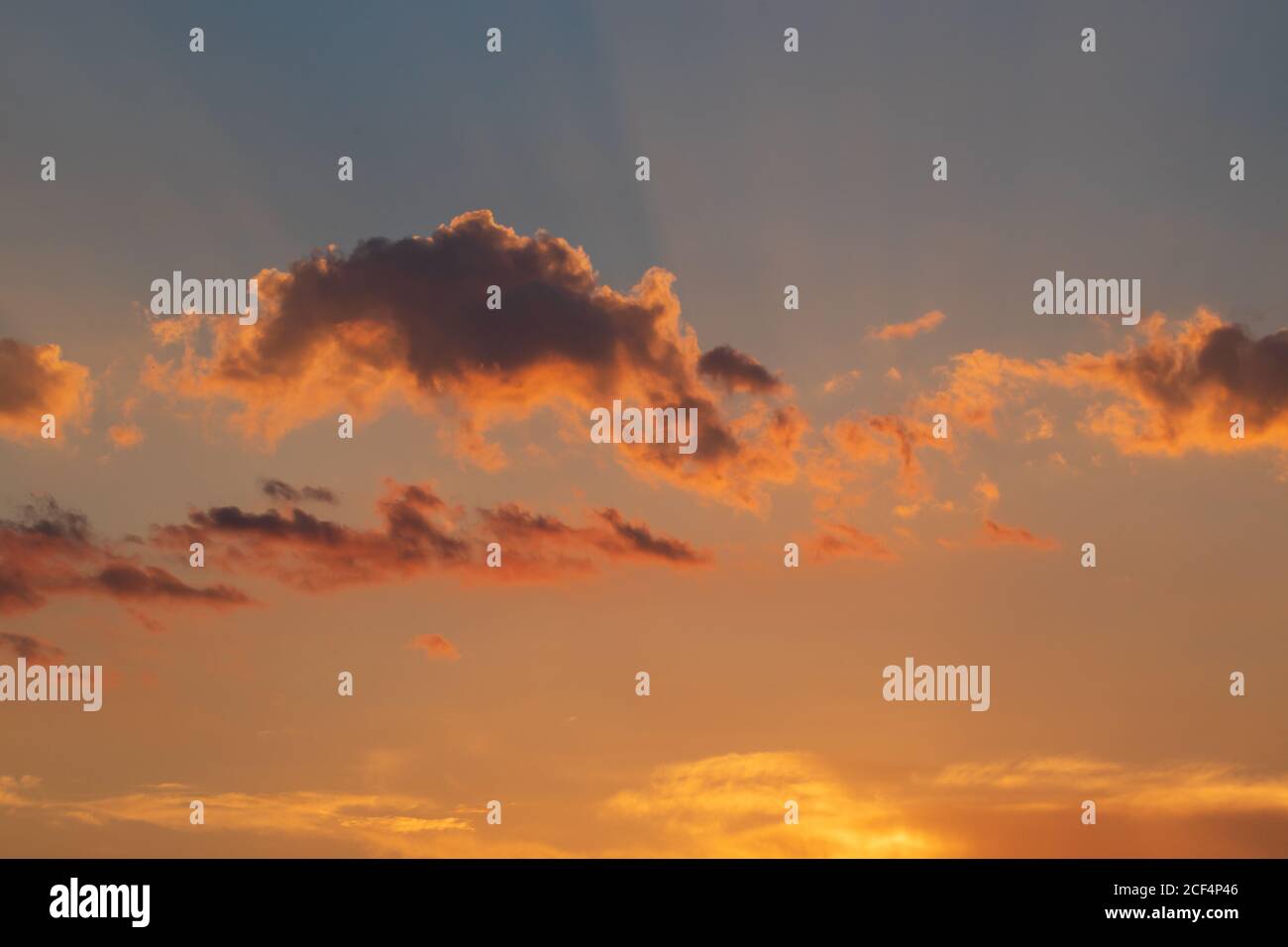 Fiery orange sunset sky. Beautiful colors and clouds Stock Photo - Alamy