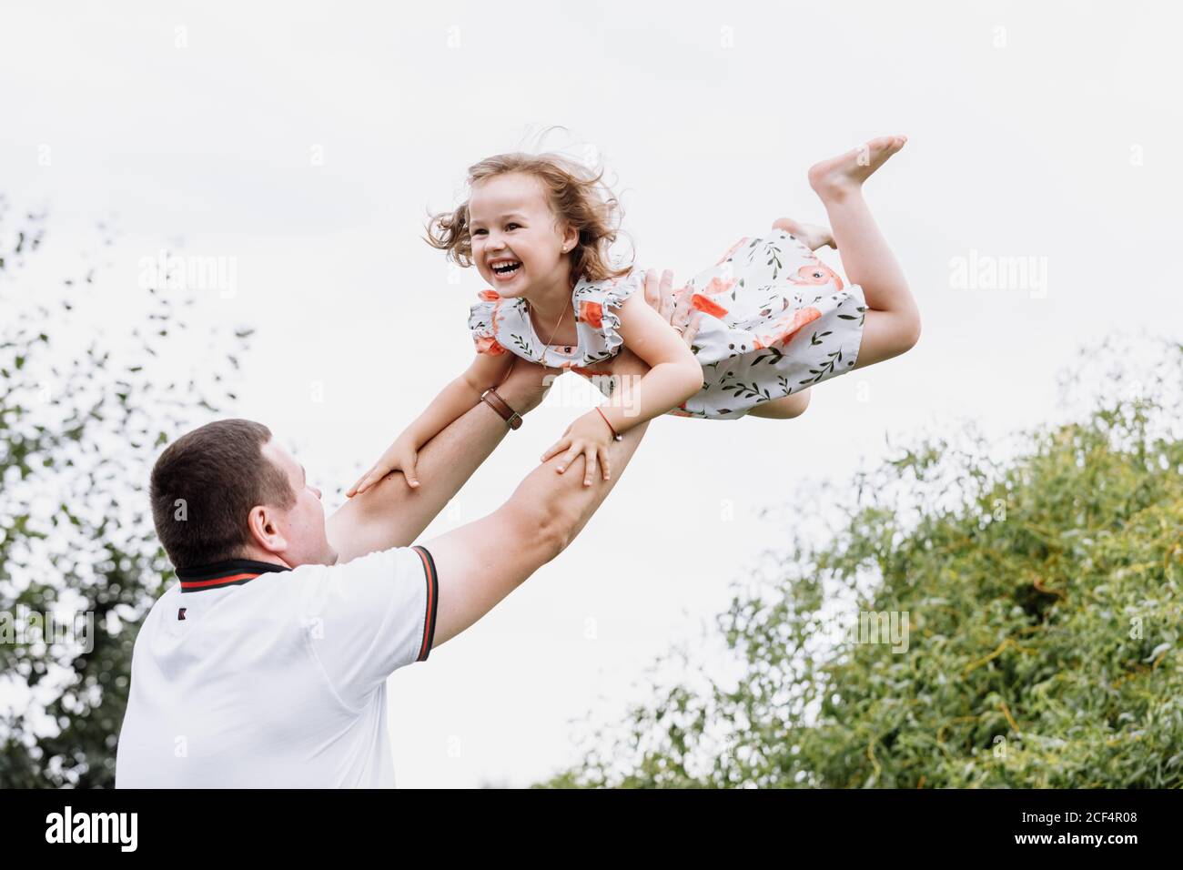Dad throwing daughter in air hires stock photography and images Alamy