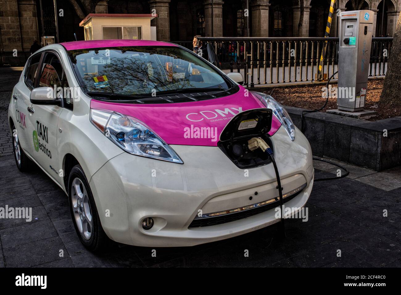 North America - Mexico, capital city Mexico City: There is a fleet of electric vehicles being used as taxis in the capital city, here a car is being c Stock Photo