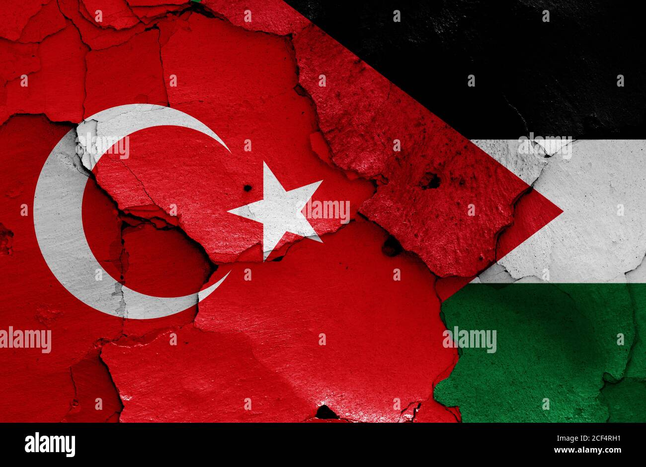 flags of Turkey and Palestine painted on cracked wall Stock Photo