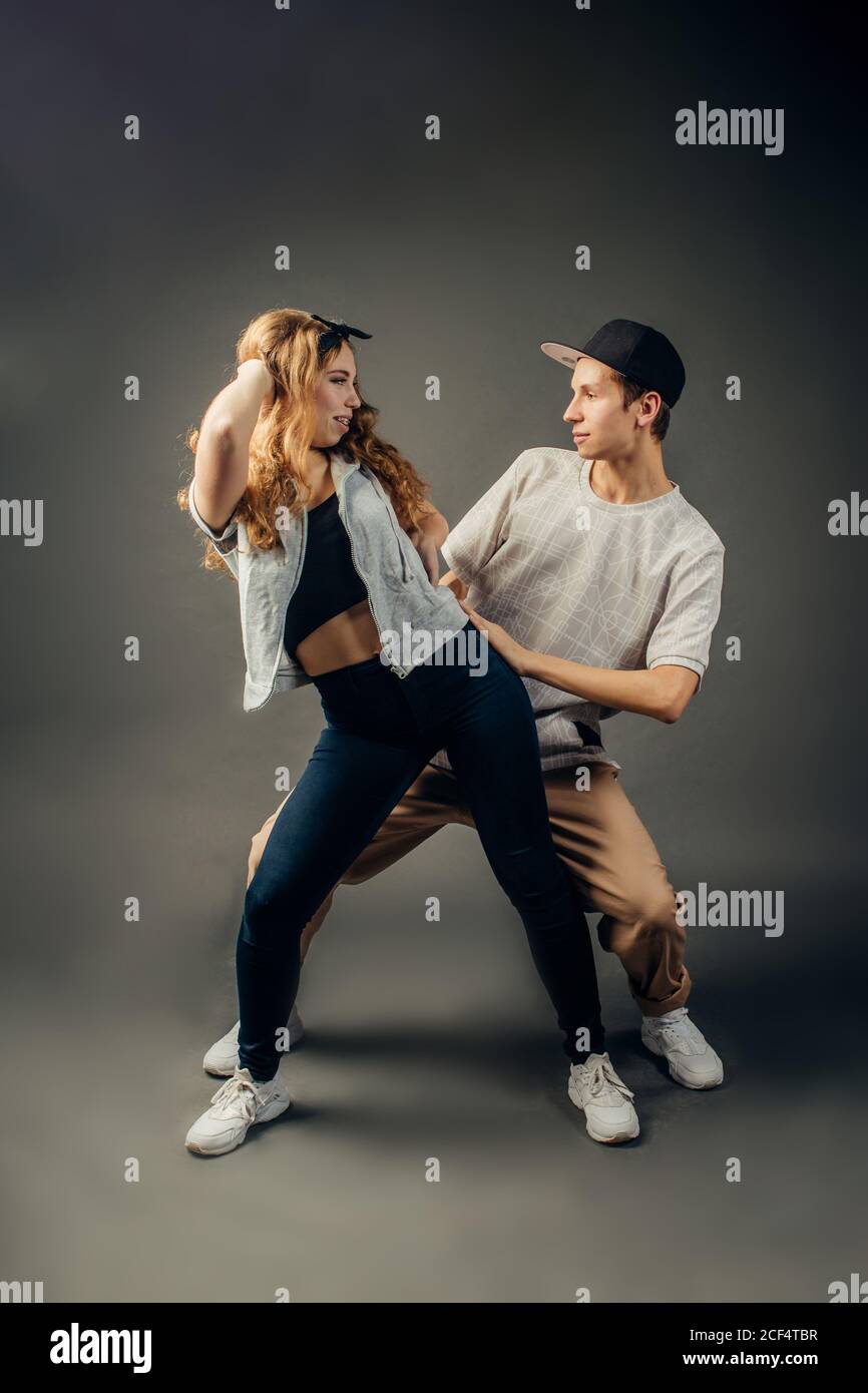 Young hip hop dancers, on studio background Stock Photo - Alamy