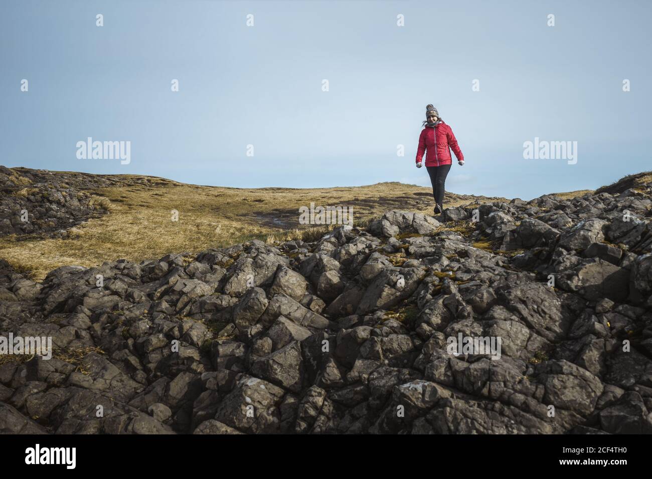 Woman enjoying amazing scenic landscape of Northern Ireland during