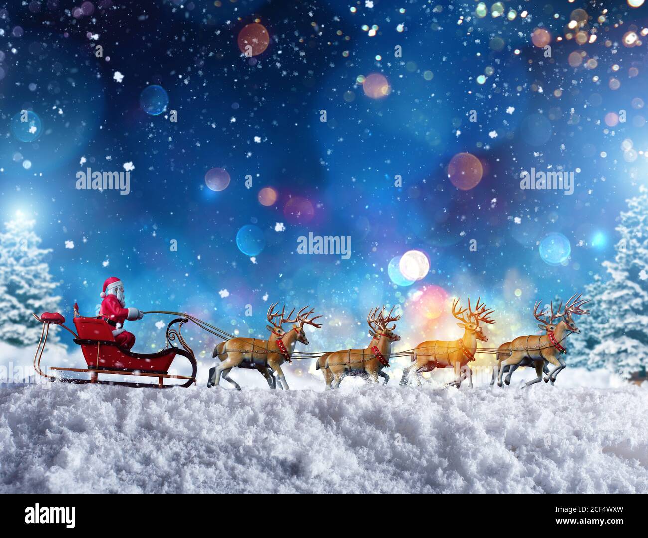 Santa claus in a sleigh ready to deliver presents with sleigh Stock Photo