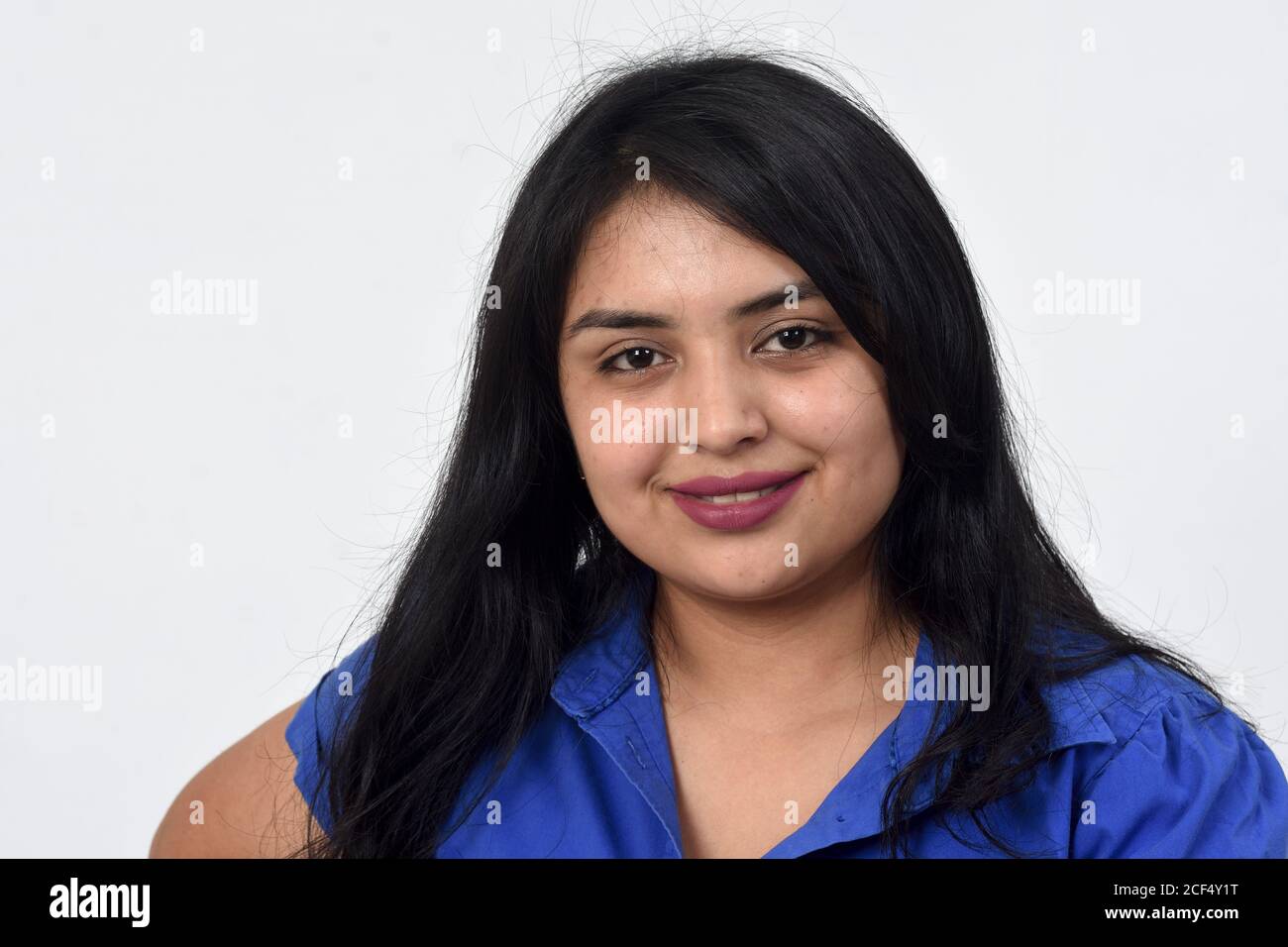 portrait of a latin woman smiling on white background Stock Photo - Alamy