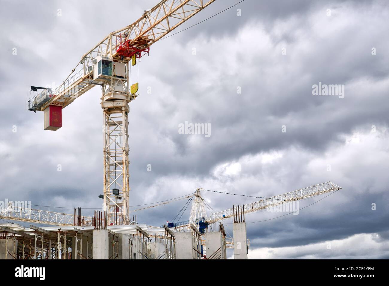 Cranes over the construction site with a cloudy sky background Stock ...