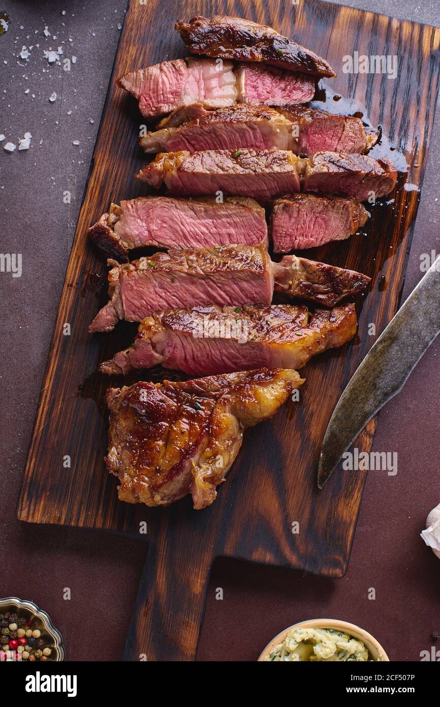 Cooked and cut ribeye black angus prime beef steak Stock Photo - Alamy