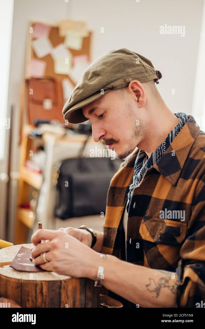 Professional crafter making leather items Stock Photo Alamy