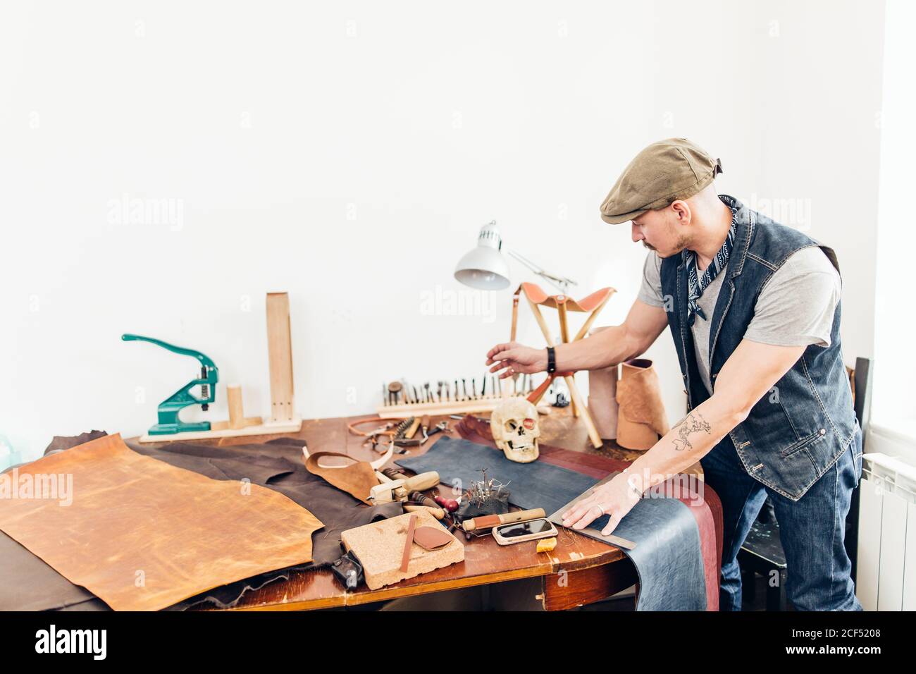 Leather craft owner at his work place Stock Photo Alamy