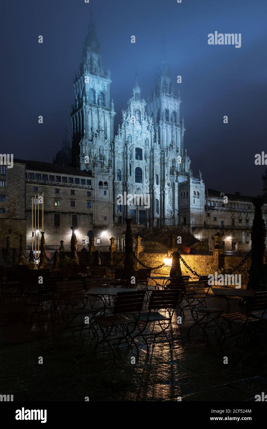 Santiago de Compostela Cathedral view at misty foggy night after rain. Cathedral of Saint James pilgrimage. Galicia, Spain Stock Photo
