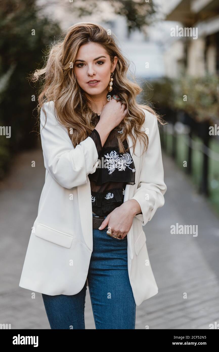 Charming lady posing on street Stock Photo Alamy