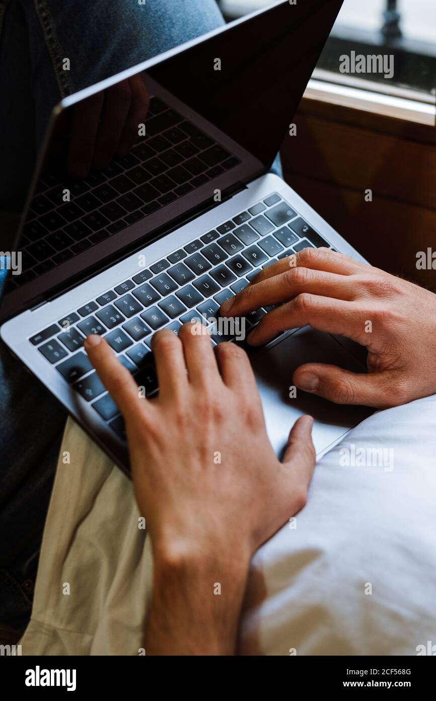 Freelancer using laptop at home Stock Photo