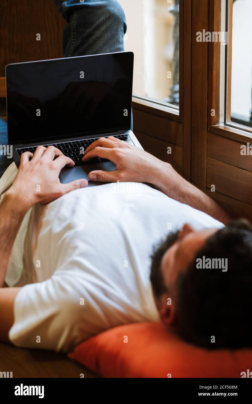 Freelancer using laptop at home Stock Photo