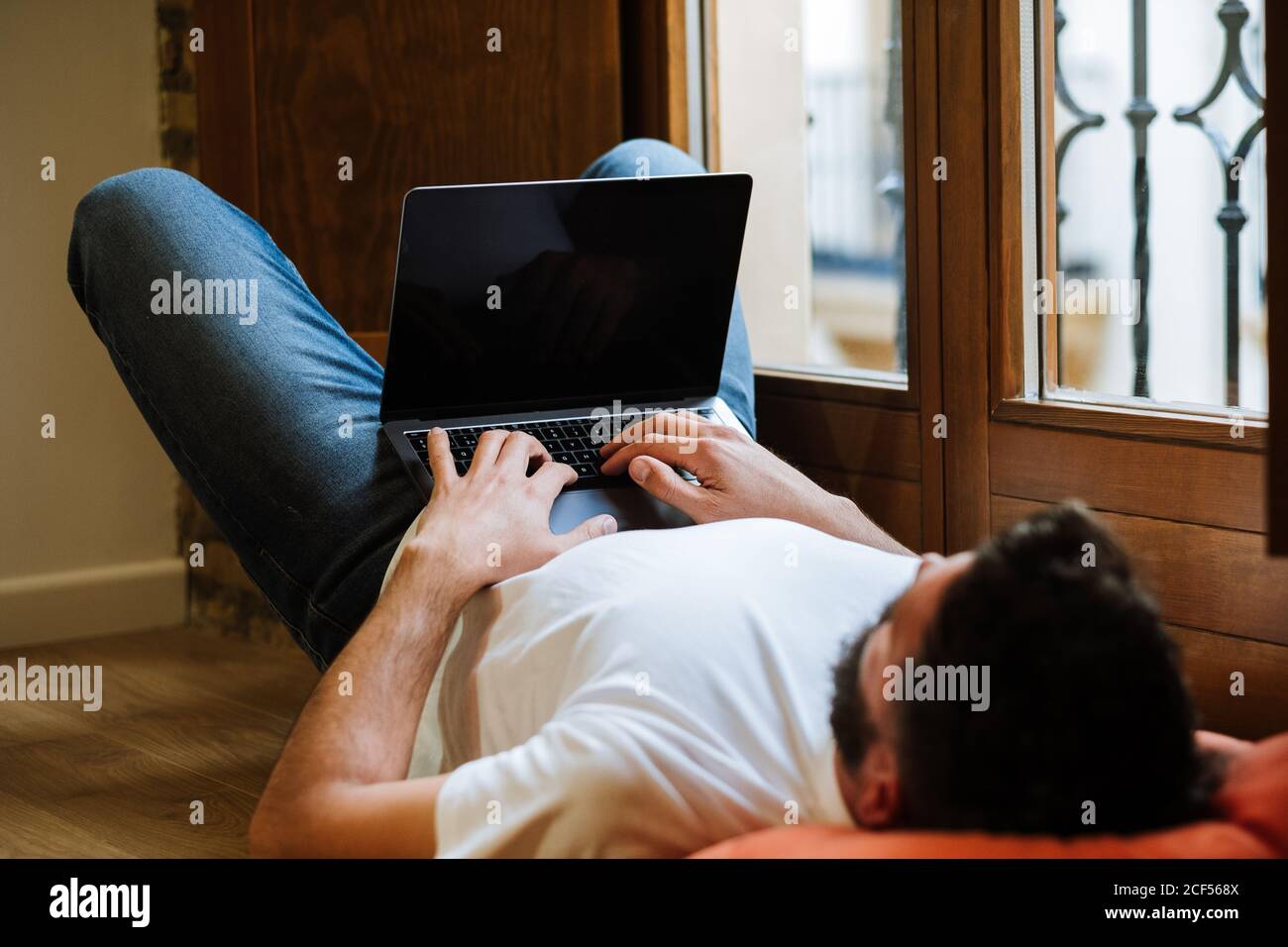 Freelancer using laptop at home Stock Photo