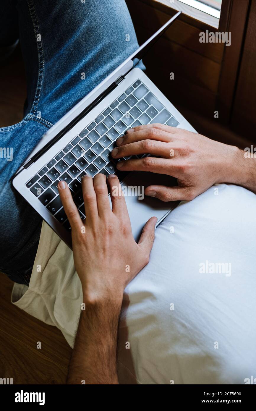 Freelancer using laptop at home Stock Photo