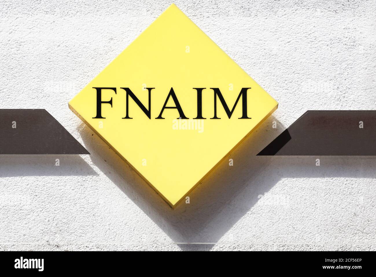 Roanne, France - July 5, 2020: FNAIM logo on a wall. FNAIM is a union of French professional unions working in the field of real estate Stock Photo
