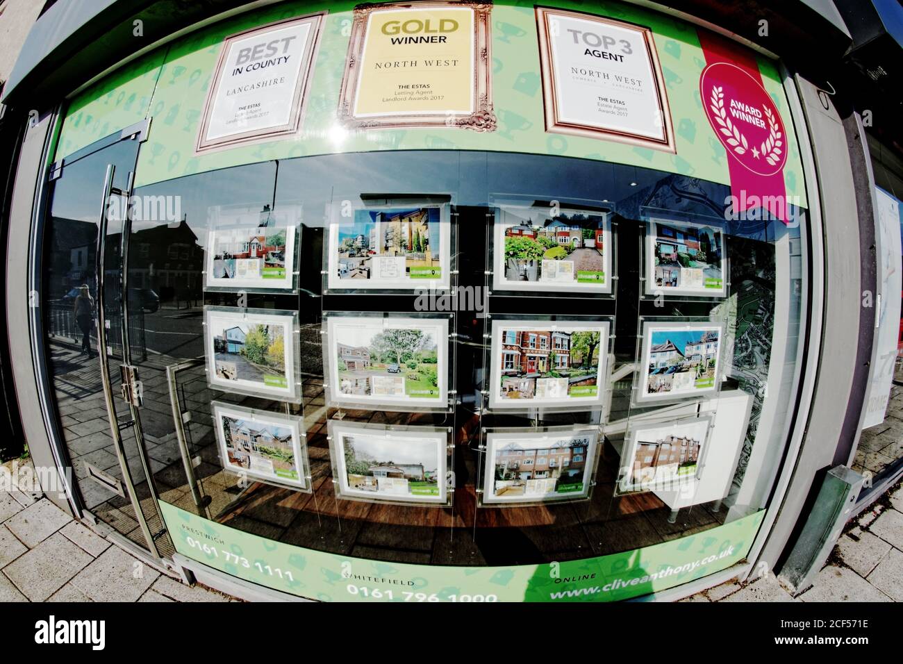 An award winning Estate Agent's window on Bury New Road in Prestwich, Greater Manchester Stock Photo