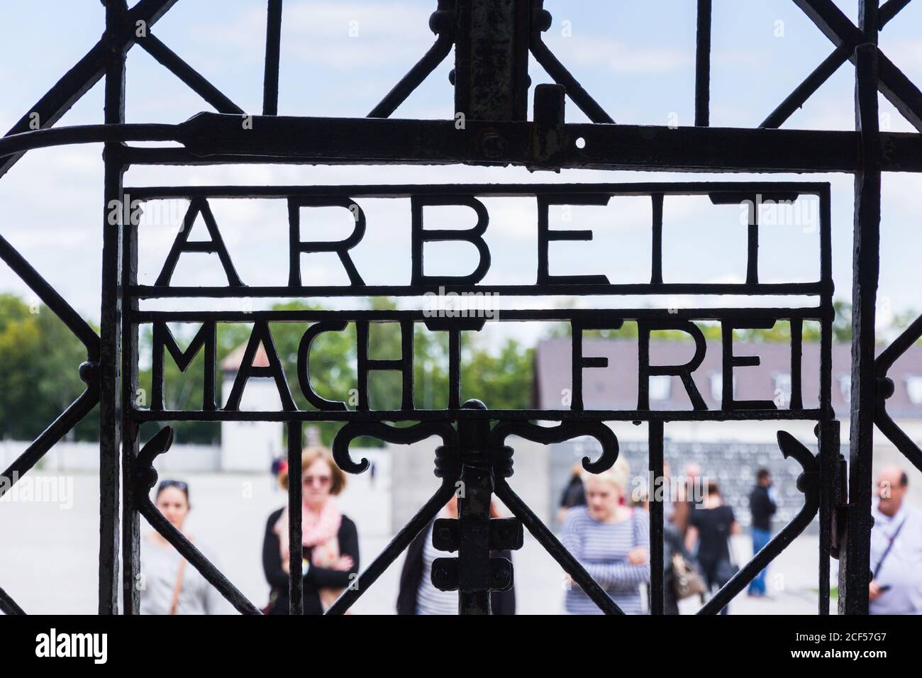 'Arbeit Macht Frei' (Work Sets You Free) wording set in metal entrance gate Dachau Nazi Concentration Camp in Upper Bavaria, Southern Germany. Stock Photo