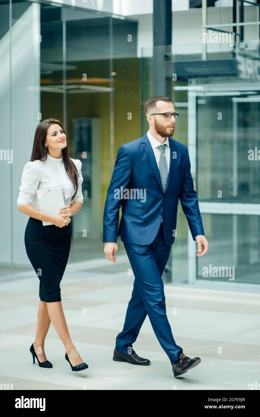 Business people walking and talking in the street Stock Photo - Alamy