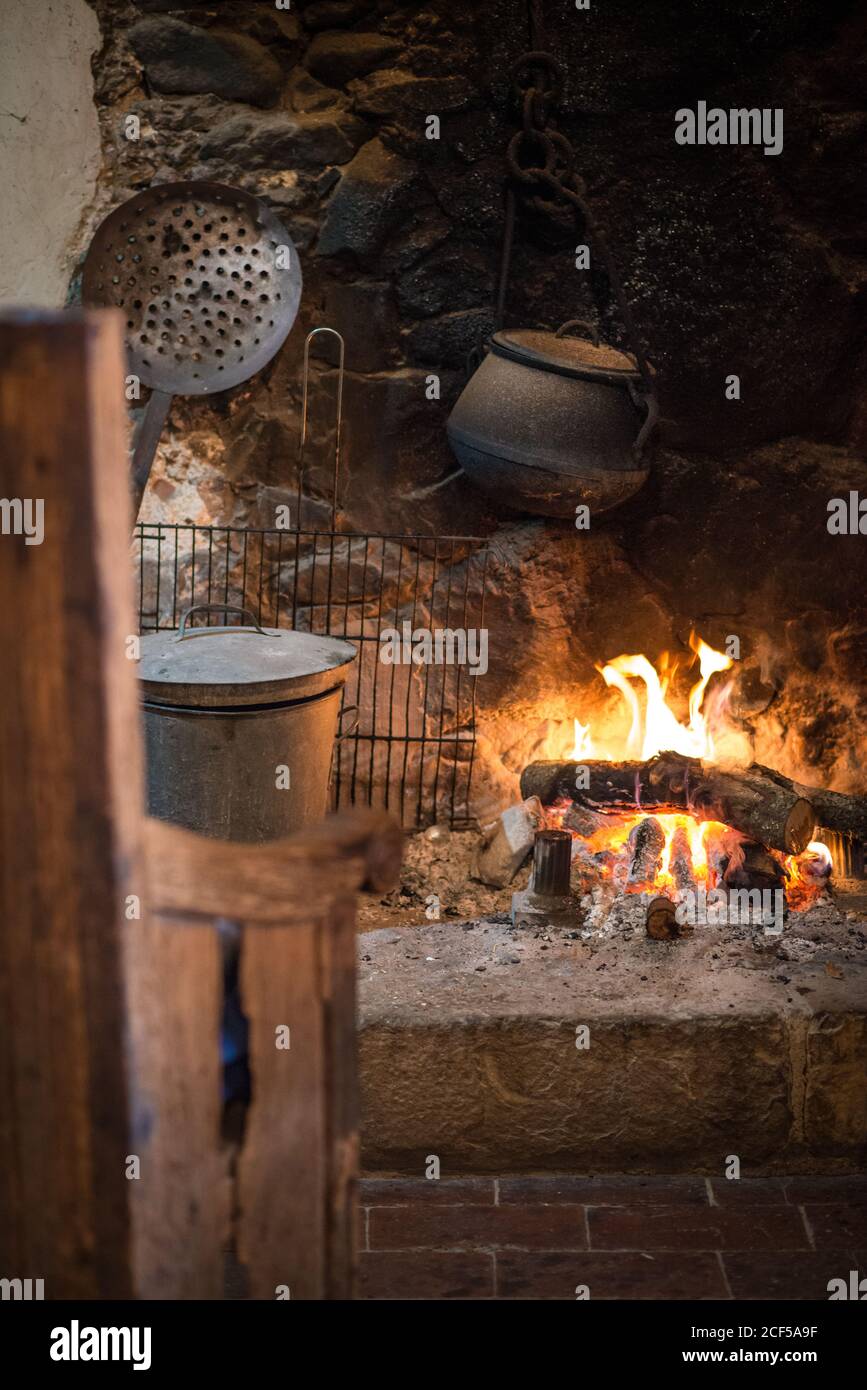 Comfortable Beautiful Kitchen With Fireplace And Housewares Like Pan And Grid Of Old Warm Village House Stock Photo Alamy