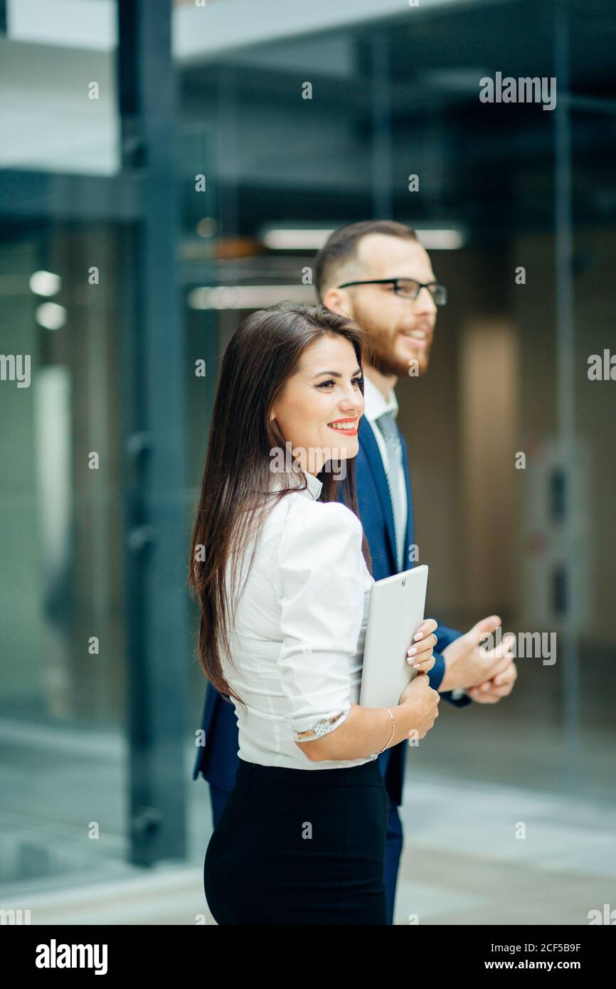 Business people walking and talking in the street Stock Photo - Alamy