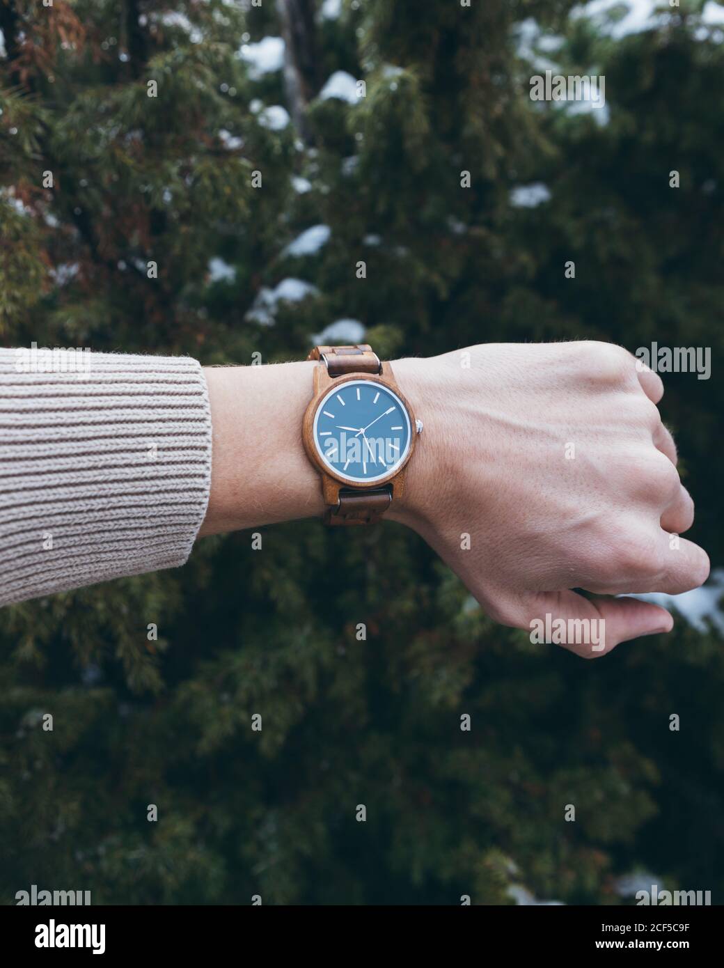 Traveler checking time on wristwatch Stock Photo