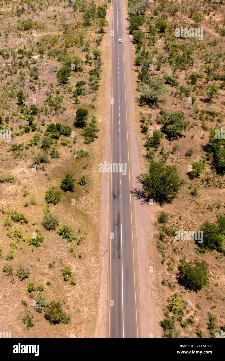 Aerial view of road near Victoria Falls flying over by helicopter Stock Photo