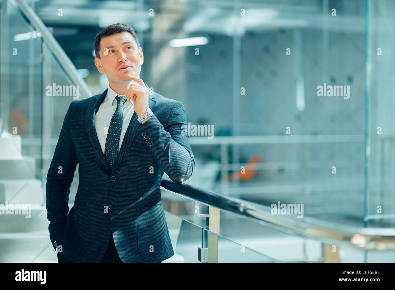 business leader looking at camera in working environment Stock Photo ...