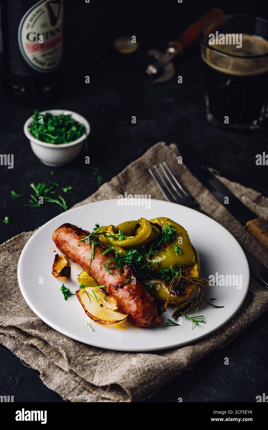 Oven baked pork sausage with bell peppers, onions and different herbs