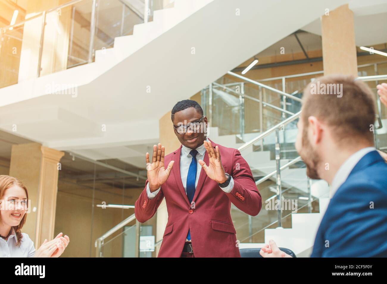 Black man leading meeting group hi-res stock photography and images - Alamy