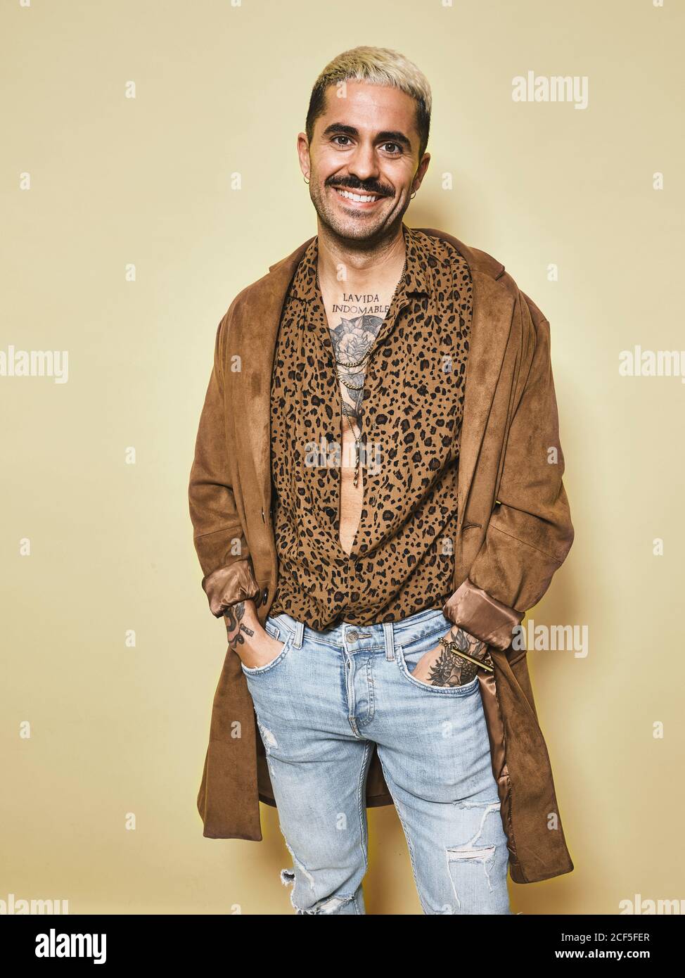 Cheerful fashionable male model with 