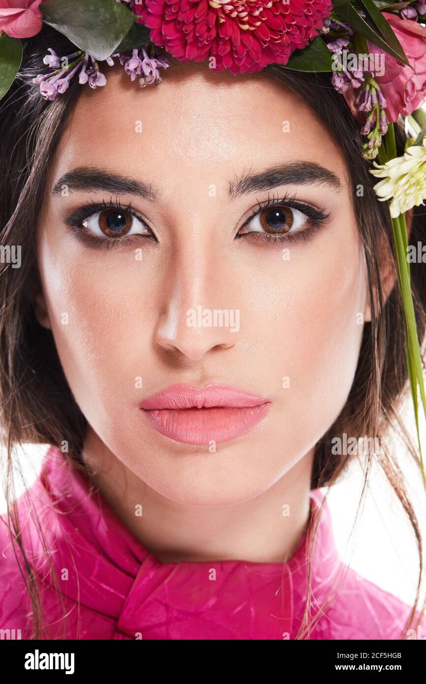 Beautiful black haired Woman with floral wreath on head and stylish ...