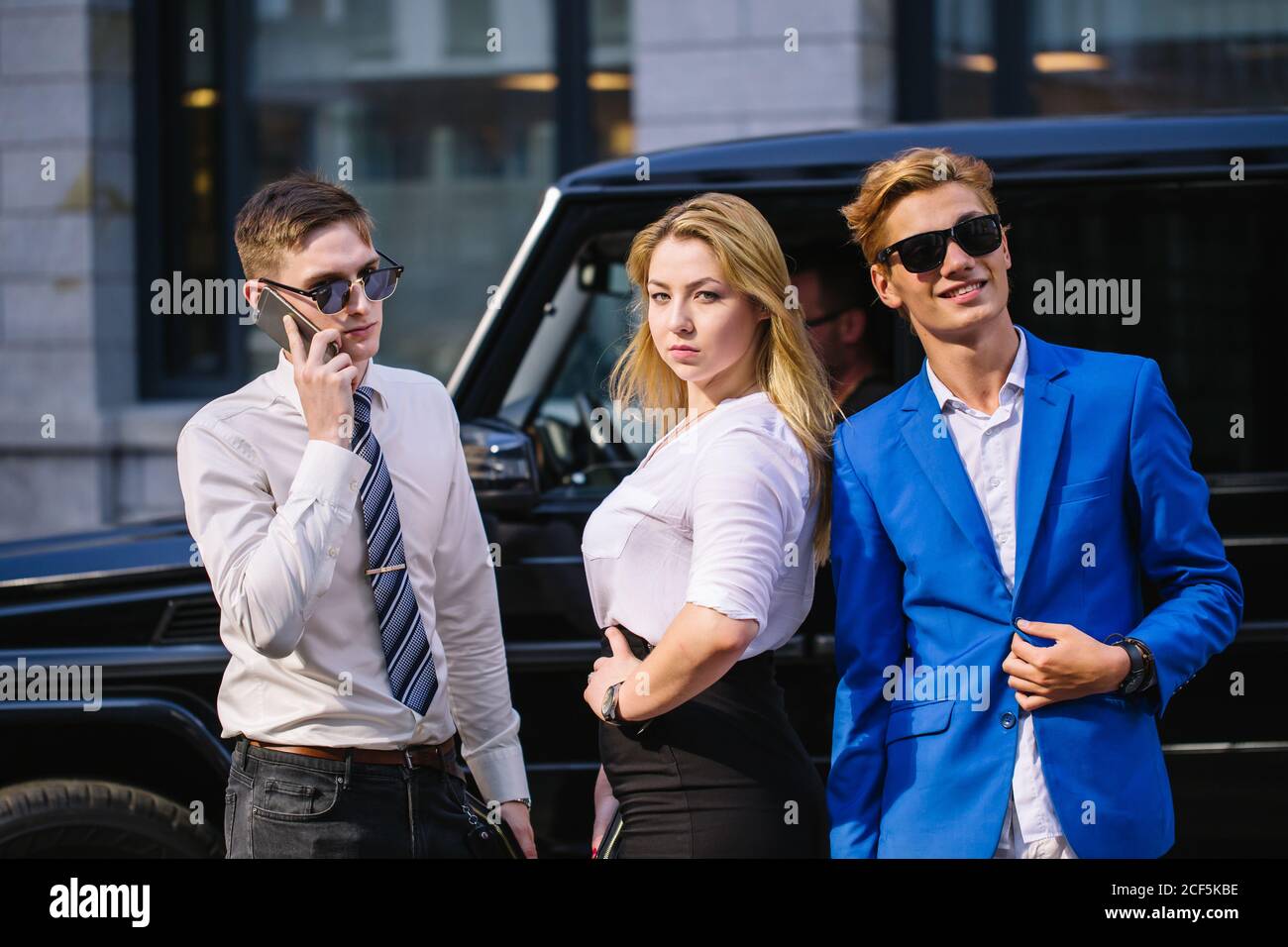 On the way to work. Full length of three smiling business people talking to each other while crossing the street Stock Photo