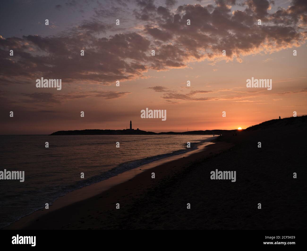 Beautiful sunset over sea with cloudy sky on a beach in the seashore ...