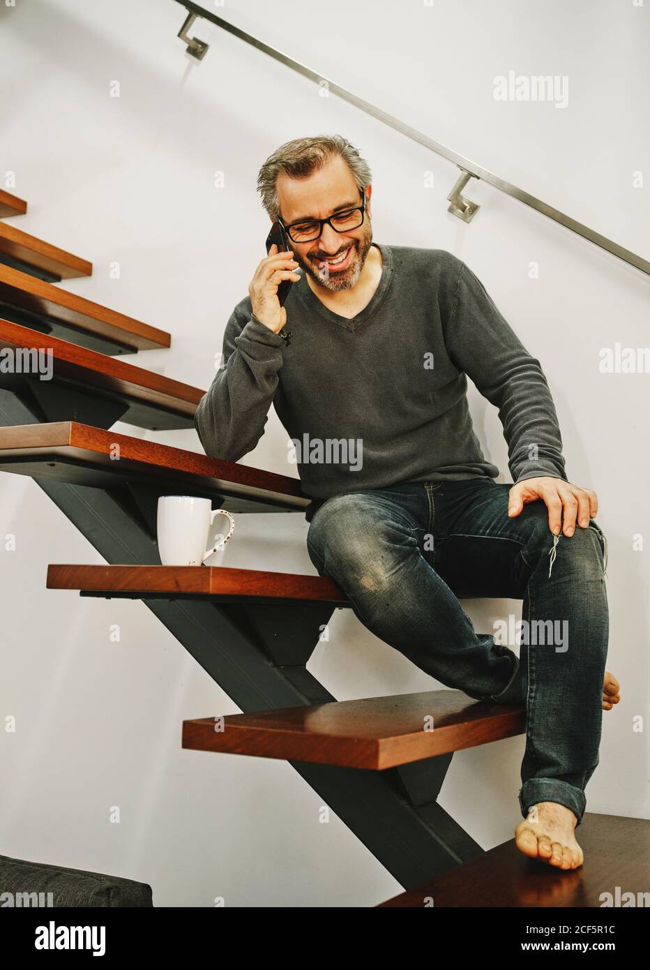 Man sitting stairs morning hi-res stock photography and images - Alamy