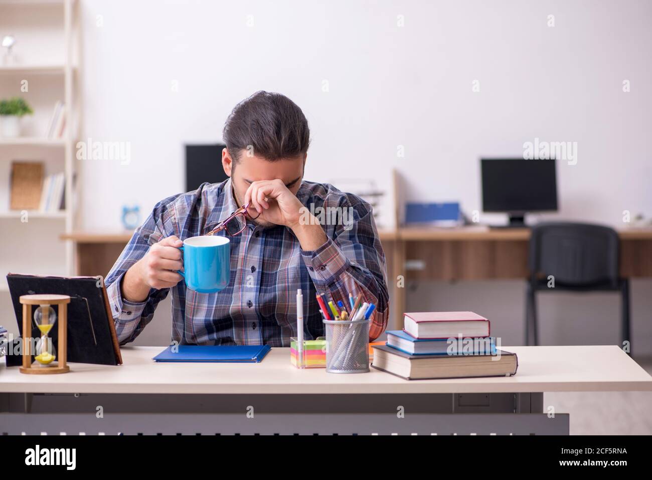 Young student sitting in the classroom Stock Photo