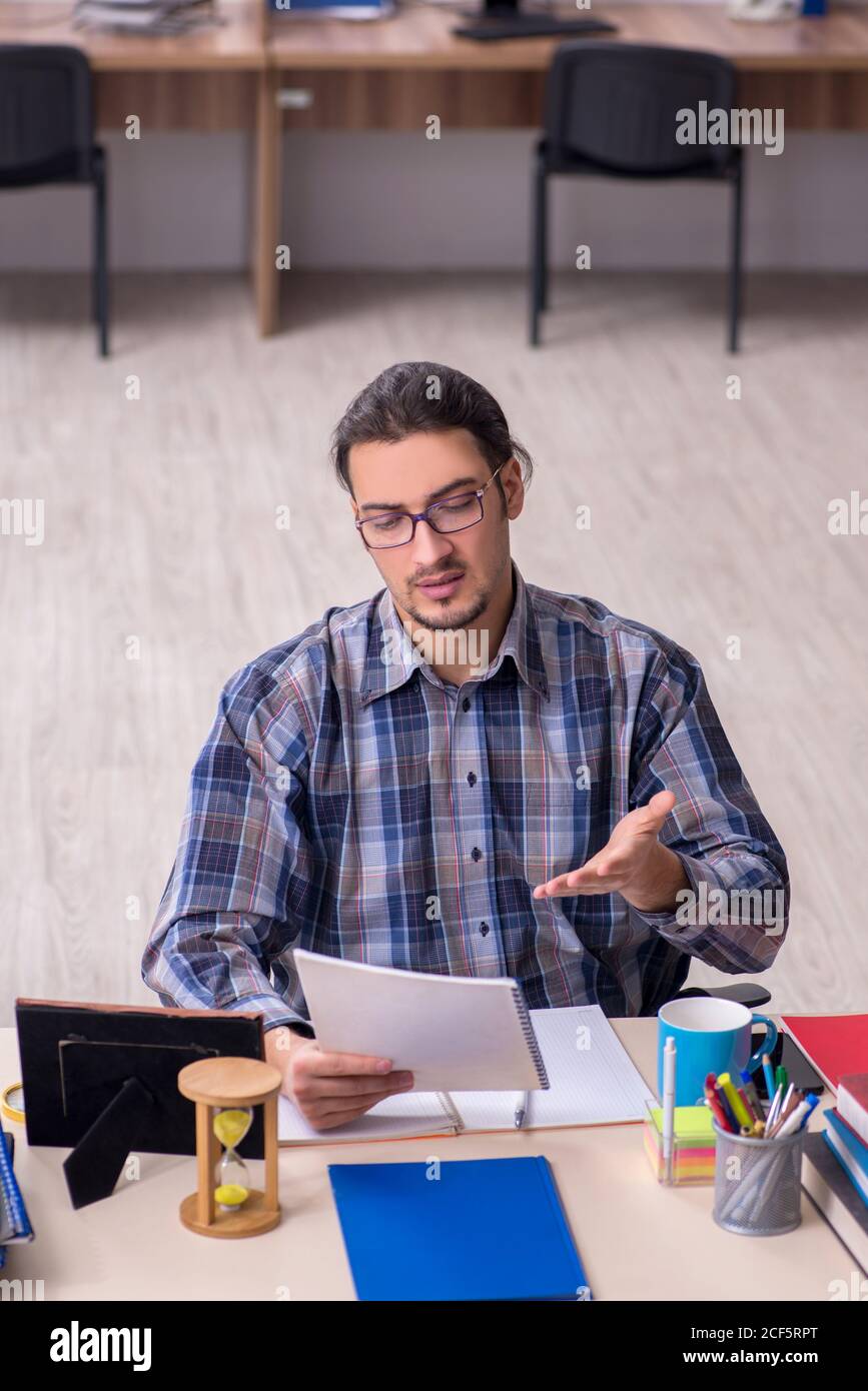 Young student sitting in the classroom Stock Photo - Alamy