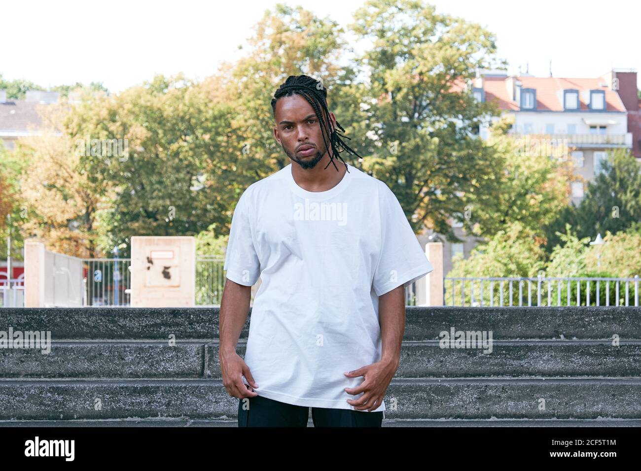 Confident African American male in casual outfit looking at camera ...