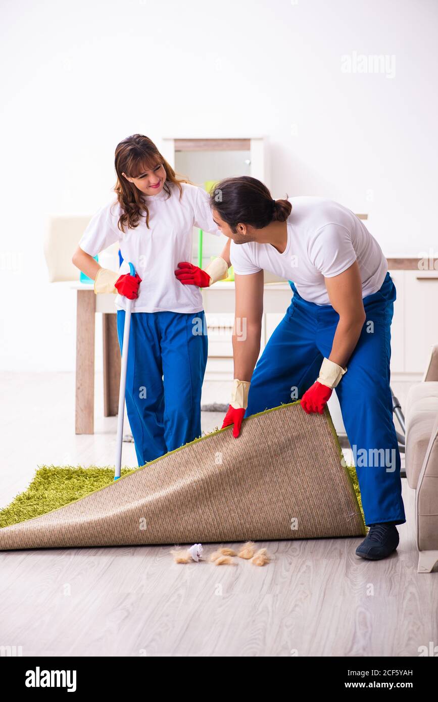 Housework Complete Young pair doing housework at the home Stock Photo - Alamy